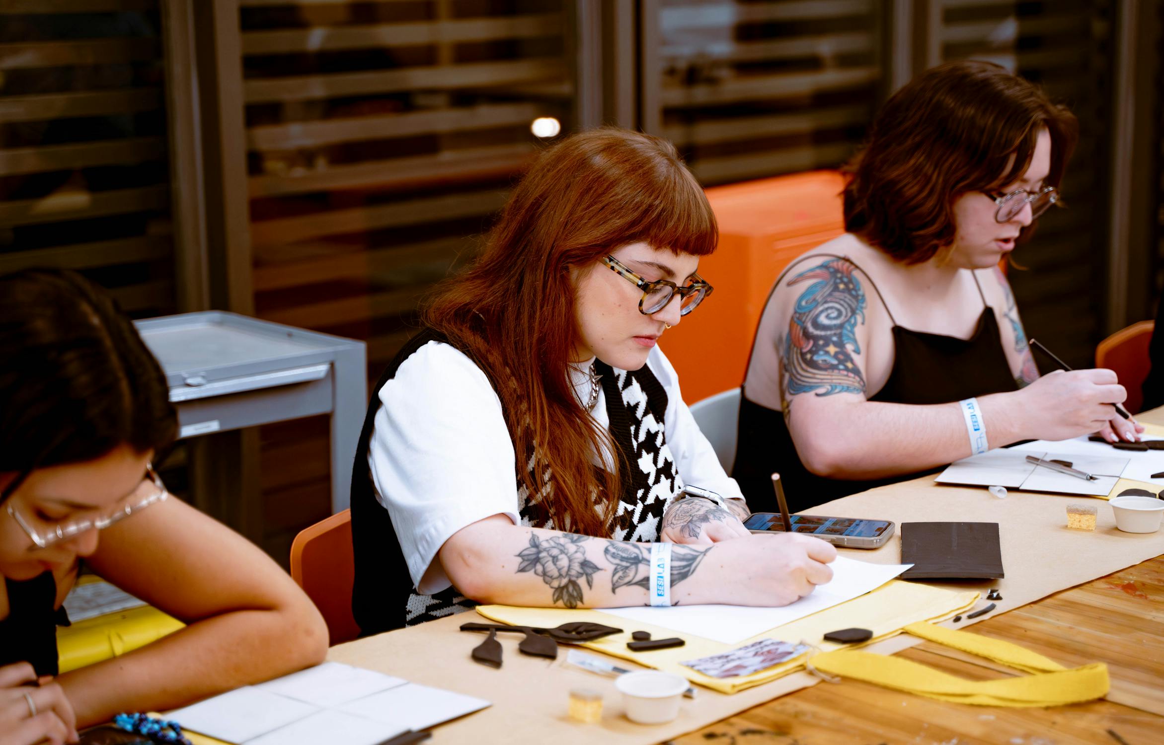 Young adults taking part in a group art workshop