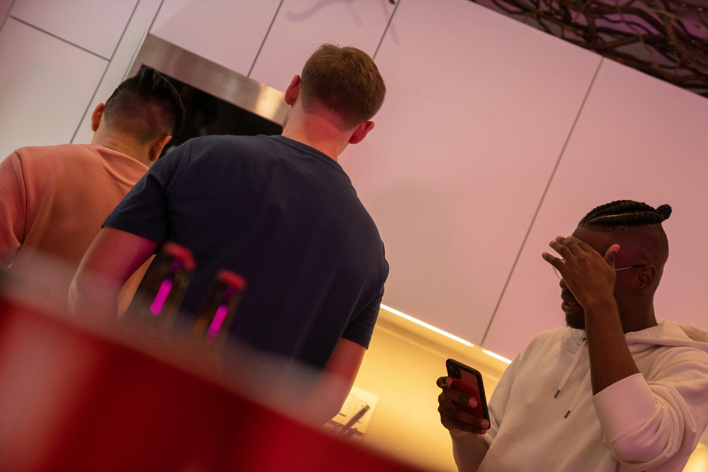 Young adults cooking together in a kitchen
